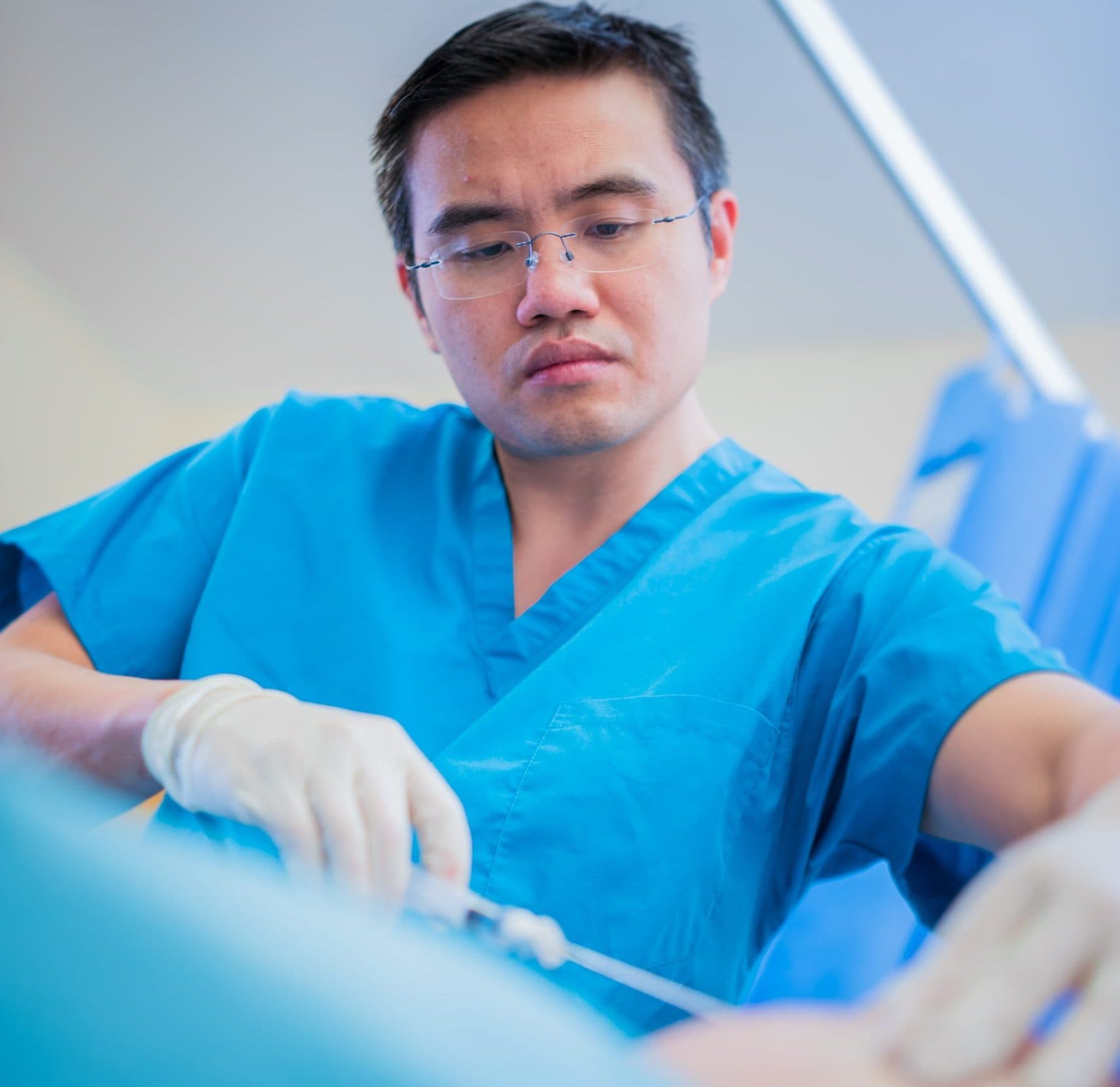 Surgeon performing cartilage transplantation procedure